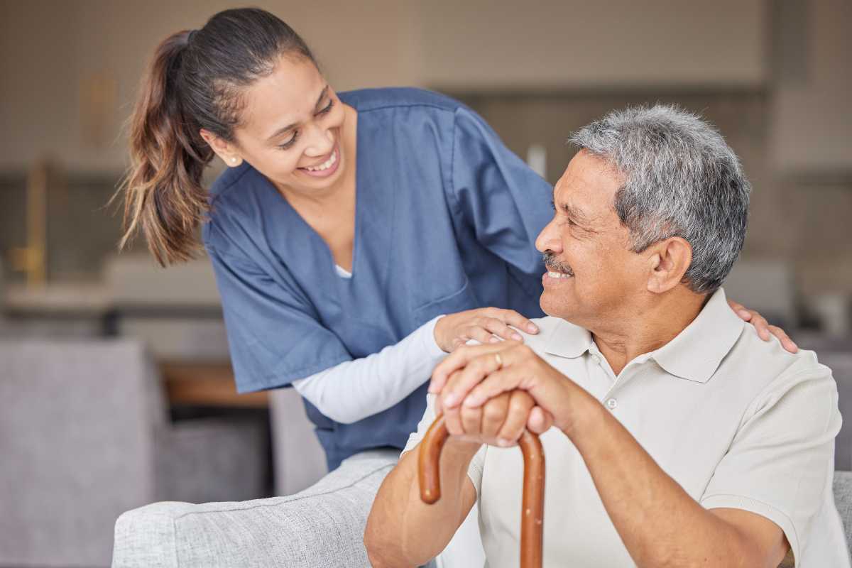 Caregiver and elderly client enjoying conversation
